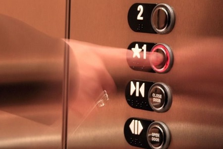 2388425 - business woman pressing elevator button